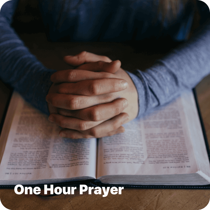Man praying with his Bible open at Pinelake Church